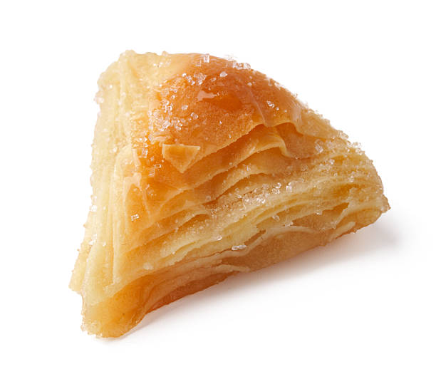 istock Delicious pastry filled with layers of flaky dough sits on a plain background ready to be enjoyed 2245257570