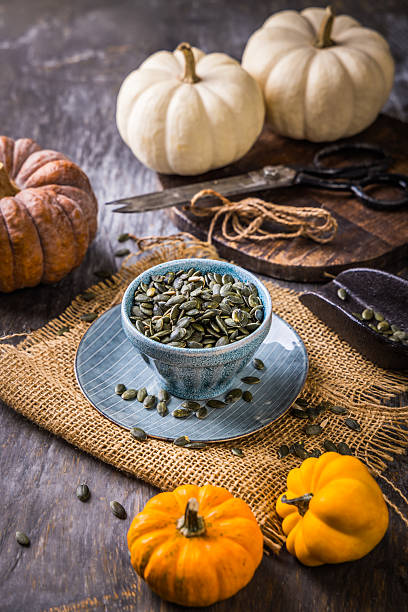 istock Organic pumpkin seeds with scoop in a bowl 2245257893
