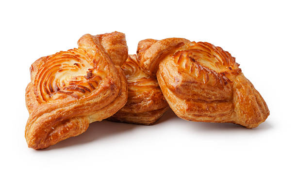 istock Freshly baked pastries displayed on a white background perfect for breakfast or dessert 2245258177