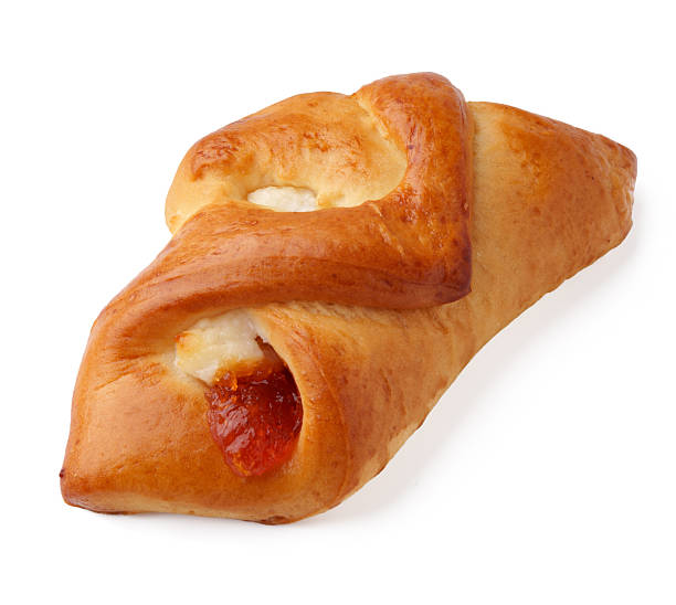 Freshly baked pastry with sweet filling displayed on a clean surface in a bright kitchen setting