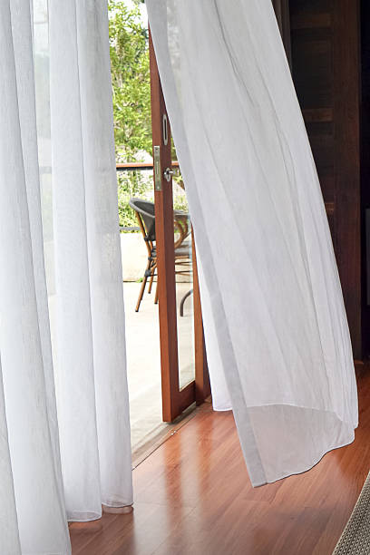 istock Airy Room with Flowing Curtains and Garden View 2245258900