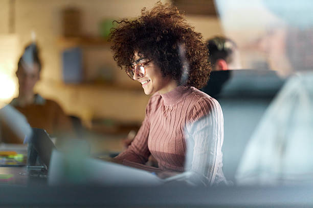 istock Happy female freelancer working on laptop in the office. 2245260716