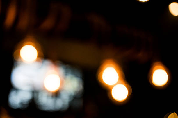 Defocused abstract texture background of bokeh background and beautiful light bulb decorated for your design