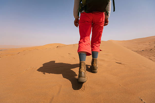 Woman backpacking in the desert