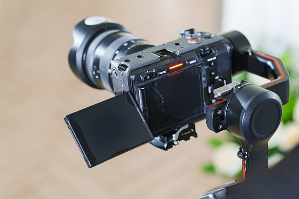 istock Camera on a gimbal setup for smooth recording in a bright indoor space 2245264905