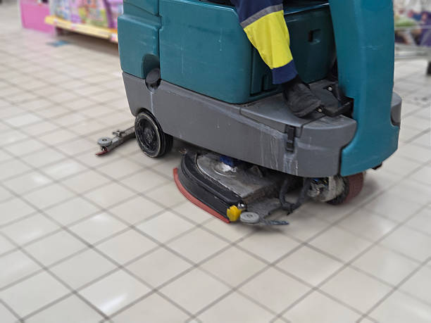 istock Cleaning machine operates in a store aisle during daytime 2245264984