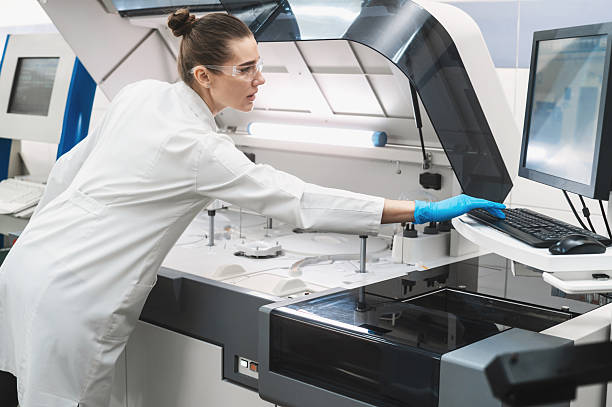 istock female scientist working in a modern equipped computer laboratory analyzes blood samples and genetic materials using special machines in a modern laboratory 2245265814