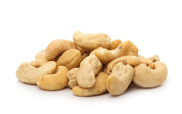 istock cashew nuts heap on white background 2245266678