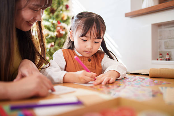 istock Mother and Daughter Making Christmas Crafts Together 2245267247