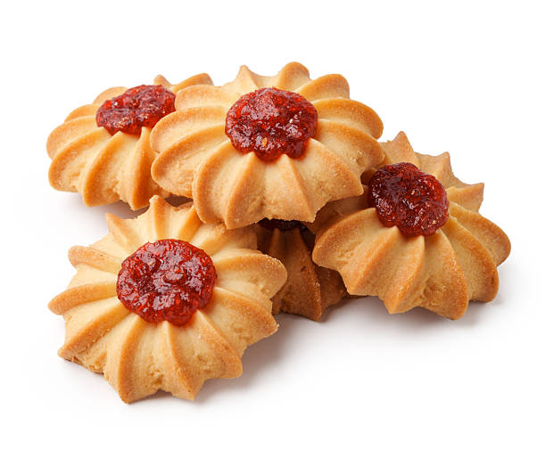 istock Delicious jam-filled cookies arranged attractively on a white background, showcasing their delightful texture and color 2245268413