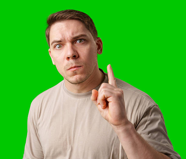 istock Thoughtful man gestures against a green background 2245268428