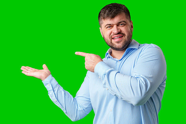 istock A man gesturing confidently with a bright green background 2245272603
