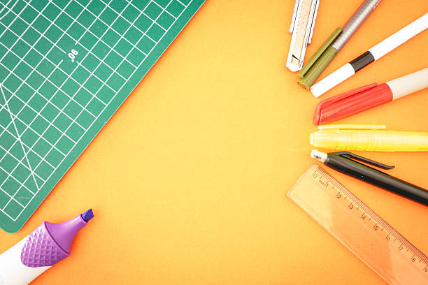 istock Different kind of school or office supplies, on a orange background 2245273149