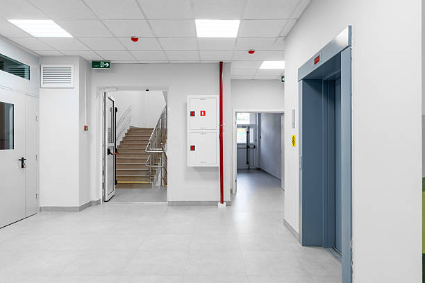 istock Clean and modern hallway with elevators and stairway in a public building 2245274740