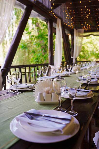 istock Elegant dining setup in a lush outdoor location 2245275384