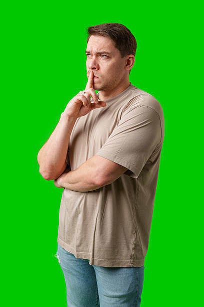 istock Thoughtful man gestures against a green background 2245276194