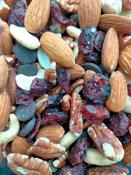 Background of assorted nuts in the foreground