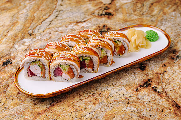 istock Delicious sushi rolls on a white plate with ginger and wasabi 2245277997