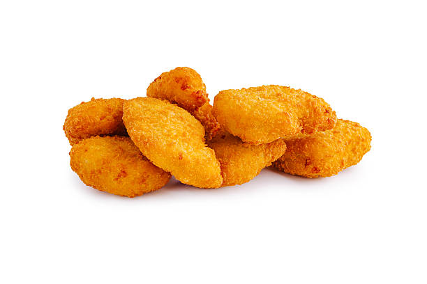 istock Golden and crispy chicken nuggets served on a white background 2245278290