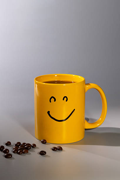 istock Bright Yellow Mug With a Smiley Face Brings Joy to Your Morning Coffee Routine 2245278740