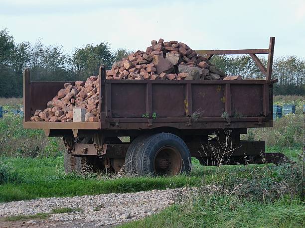 heavy sandstone slabs stacked on old truck for construction transport