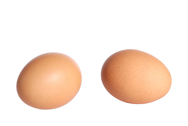 istock Two brown chicken eggs isolated on white background. Suitable for organic food, protein, natural nutrition, healthy lifestyle themes. Perfect for cooking, clean eating, and farm-fresh product design. 2245280185