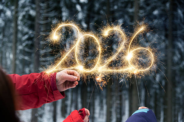 istock Hands writing 2026 with sparklers - New Year Celebration Party 2245281289