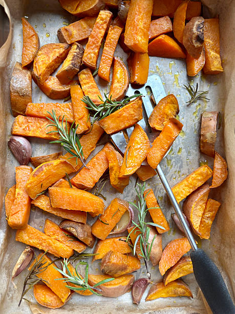 istock Baked sweet potatoes with rosemary. 2245283968