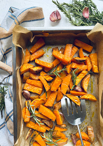 istock Baked sweet potatoes with rosemary. 2245283998