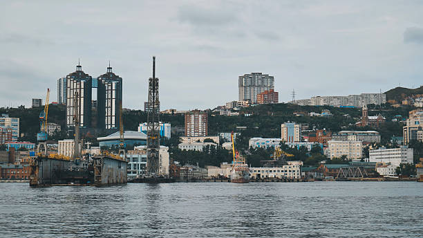 istock Cranes and shipyards dominate the foreground, while modern buildings rise in the background, creating a dynamic cityscape of vladivostok 2245285051