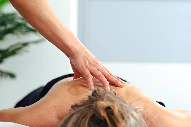 istock Unrecognizable therapist giving relaxing leg massage to client in professional spa setting 2245285973