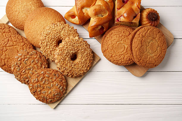 istock Assorted cookies displayed on wooden board in a cozy setting ready for a delightful snack or dessert time 2245285992