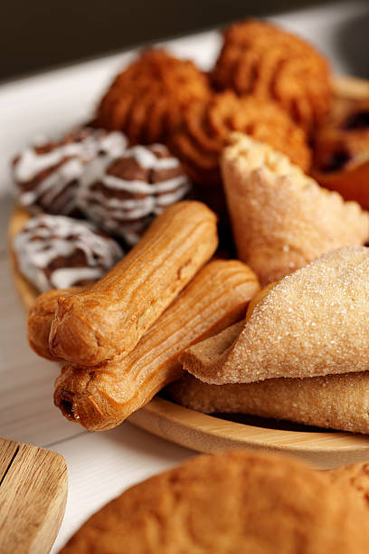 istock Assorted traditional pastries displayed on a wooden plate during a festive gathering 2245286345