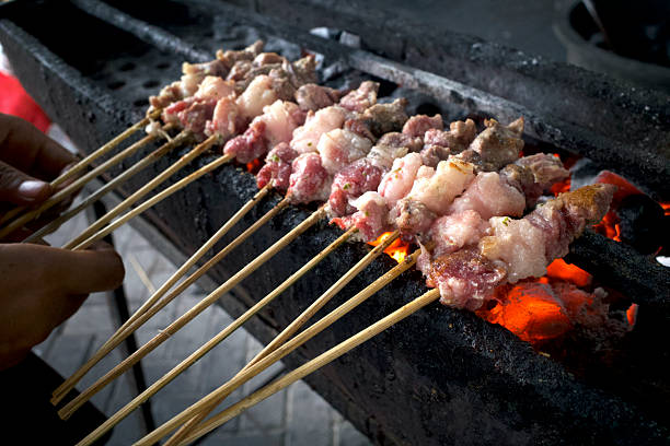 istock Preparation for grilling goat satay, Sate Kambing or Lamb Satay, a traditional satay from Yogyakarta, Indonesia 2245287650