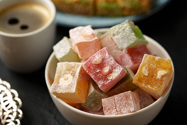 istock Colorful Turkish delight served with a cup of coffee on a dark table during afternoon tea 2245291670