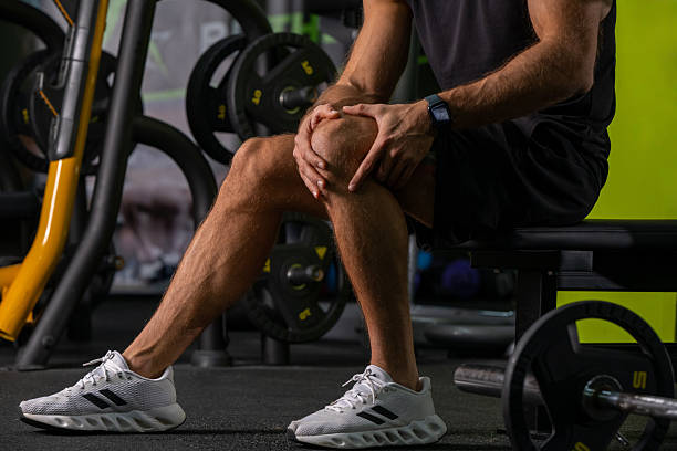 istock Gym accident or overuse injury: Man suffering from knee strain 2245291777