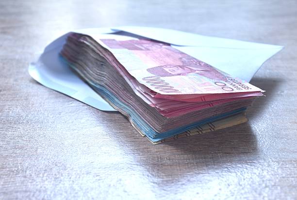 istock indonesia rupiah banknote in white envelope on wooden table 2245292823