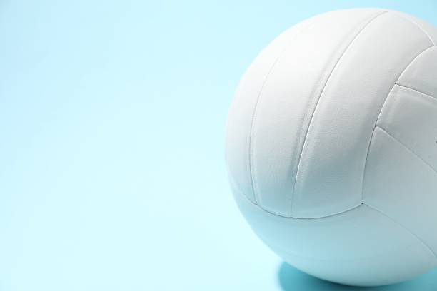 istock White volleyball ball on light blue background, closeup. Space for text 2245295343