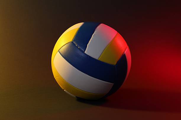 istock Volleyball ball on dark background in color lights 2245295387