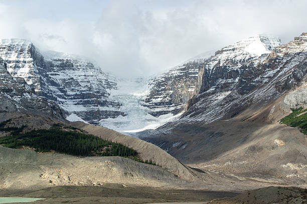 istock Alpine glacier with steep cliff face in Jasper National Park, Canada 2245299690