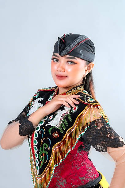 istock Javanese Jathilan dancer in vibrant traditional attire performs a graceful pose, showcasing Indonesia's rich cultural heritage through detailed costume, colors, and expressive elegance. 2245300049