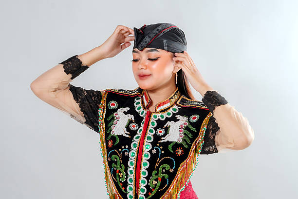 istock A Javanese traditional dancer gracefully adjusts her headpiece while wearing an intricate Jathilan costume, showcasing elegance, beauty, and the cultural heritage of Indonesia. 2245300201