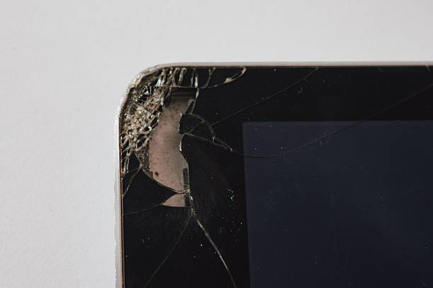 istock Impact damage: severe crack in a tablet screen showing the components underneath the glass 2245304451