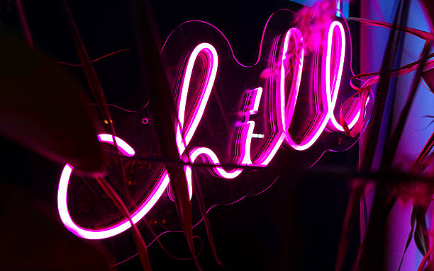 istock Bright magenta neon sign spelling 