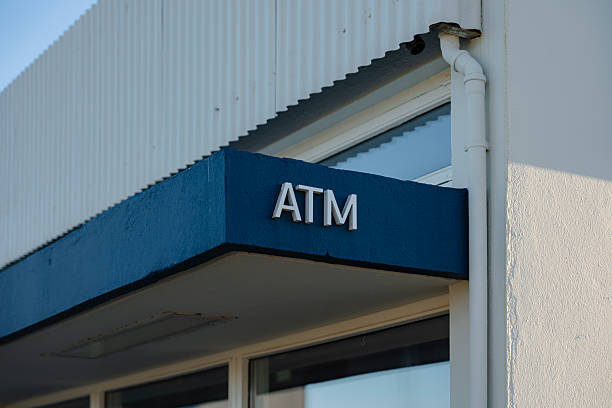 istock Automated teller machine entrance featuring clear signage and blue awning. 2245304866