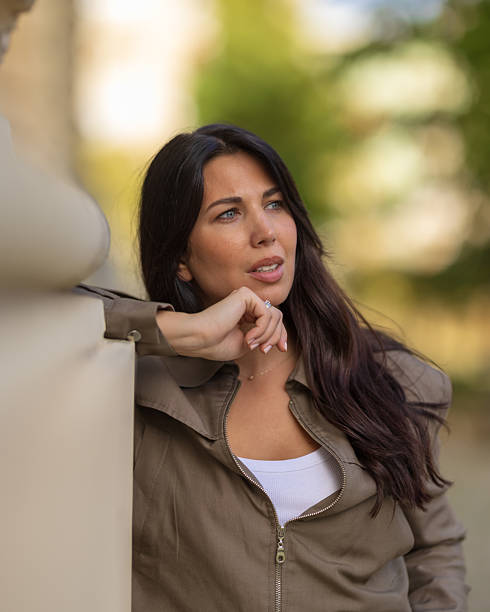 istock young beautiful woman in a jacket looking at the camera 2245306766
