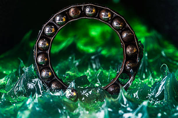 istock Ball bearing immersed in grease 2245307117