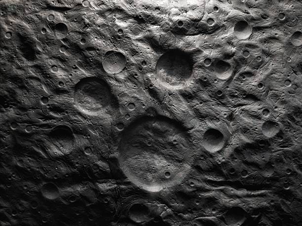 Planetary moon, orbital image. Surface of rocky satellite with craters and furrows. Cosmic landscape.