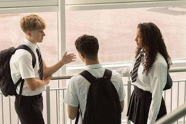istock High school friends chatting on school stairway 2245309005