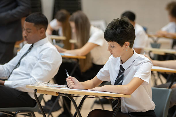 istock High school student sitting an exam in a large hall 2245310434